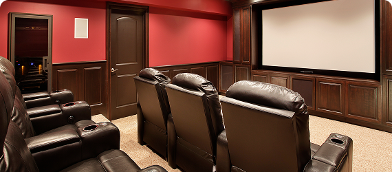 home theater with leather movie-theater-style seats and a large movie screen
